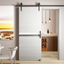 Front view of a gray 28 inch by 80 inch melamine sliding barn door mounted on a wall-mounted track