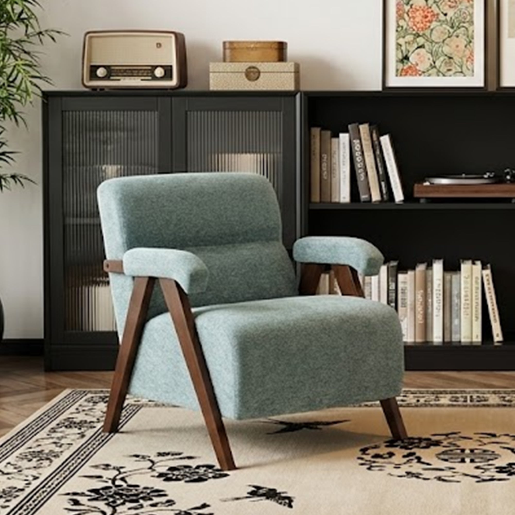 Front view of a green mid-century modern accent chair with tufted back, wooden arms, and inverted V-legs