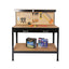 Front view of black steel workbench with MDF top, pegboard mounted at back, and drawer below