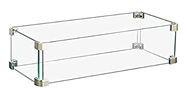 Front view of white-framed glass wind guard standing upright beside a fire table Main image