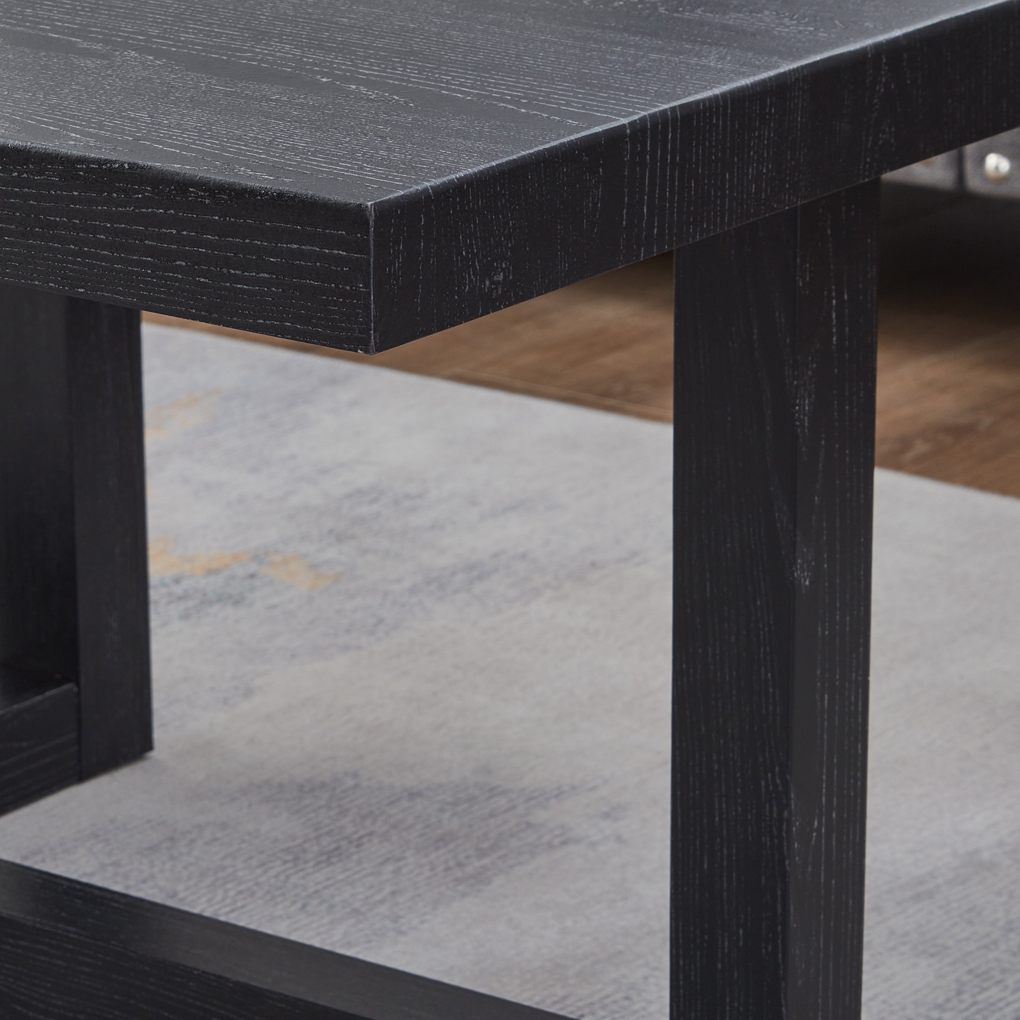 Side profile of black end table showing low 5.36-inch height and base detail
