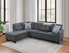 Front view of dark gray L-shaped sectional sofa with rounded arms and nailhead trim