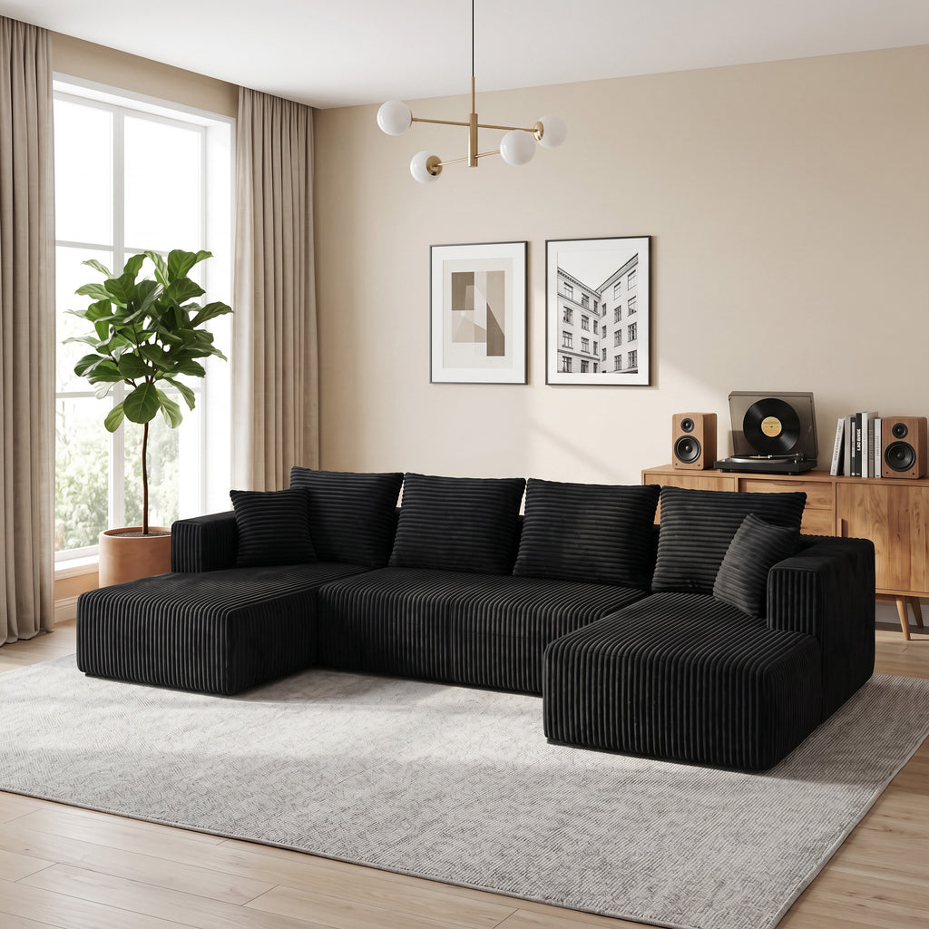 Close-up of wide-wale corduroy fabric texture on black sectional sofa