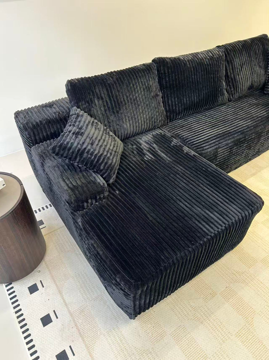 Sofa mid-unfolding after unpacking, showing soft foam expansion