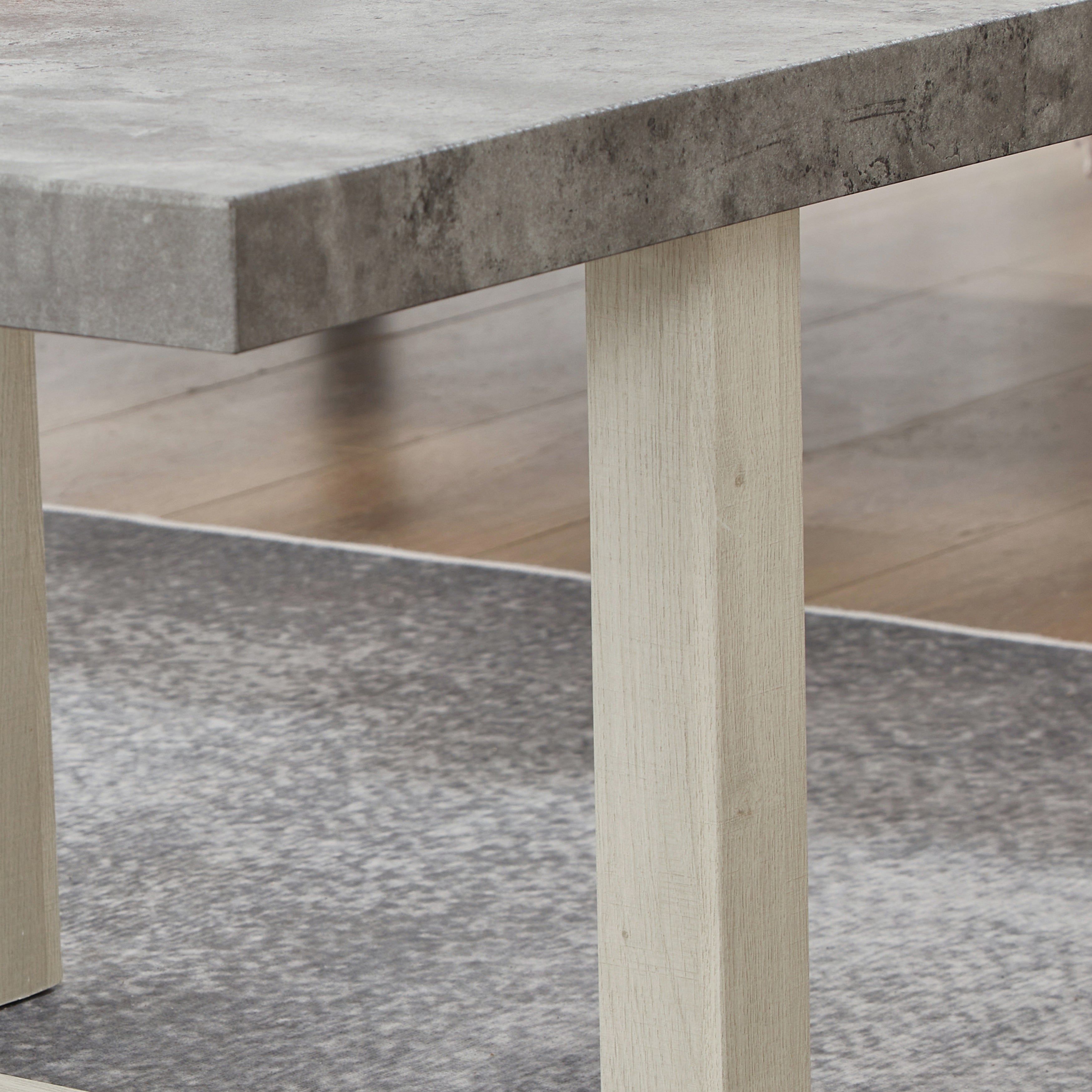 Luno End Table styled beside a neutral sofa in a modern living room setting
