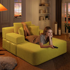 Six soft pillows arranged on the yellow corduroy chaise lounge
