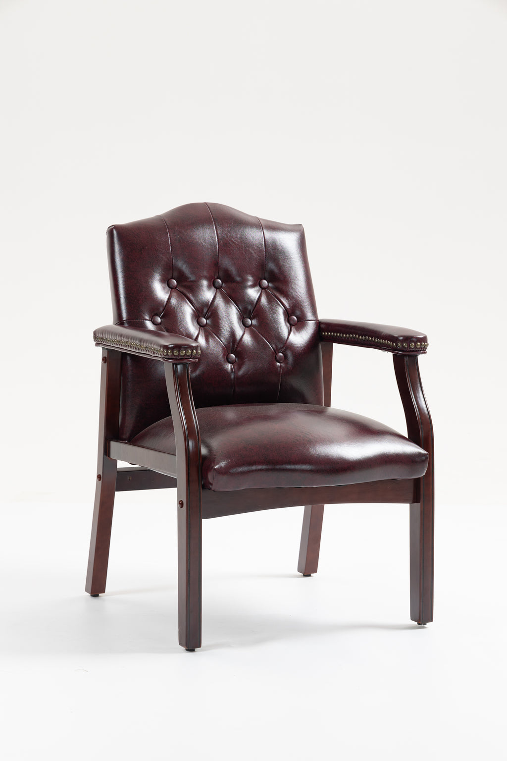 Front view of burgundy leather guest chair with button-tufted seat, padded arms, and mahogany-finish legs