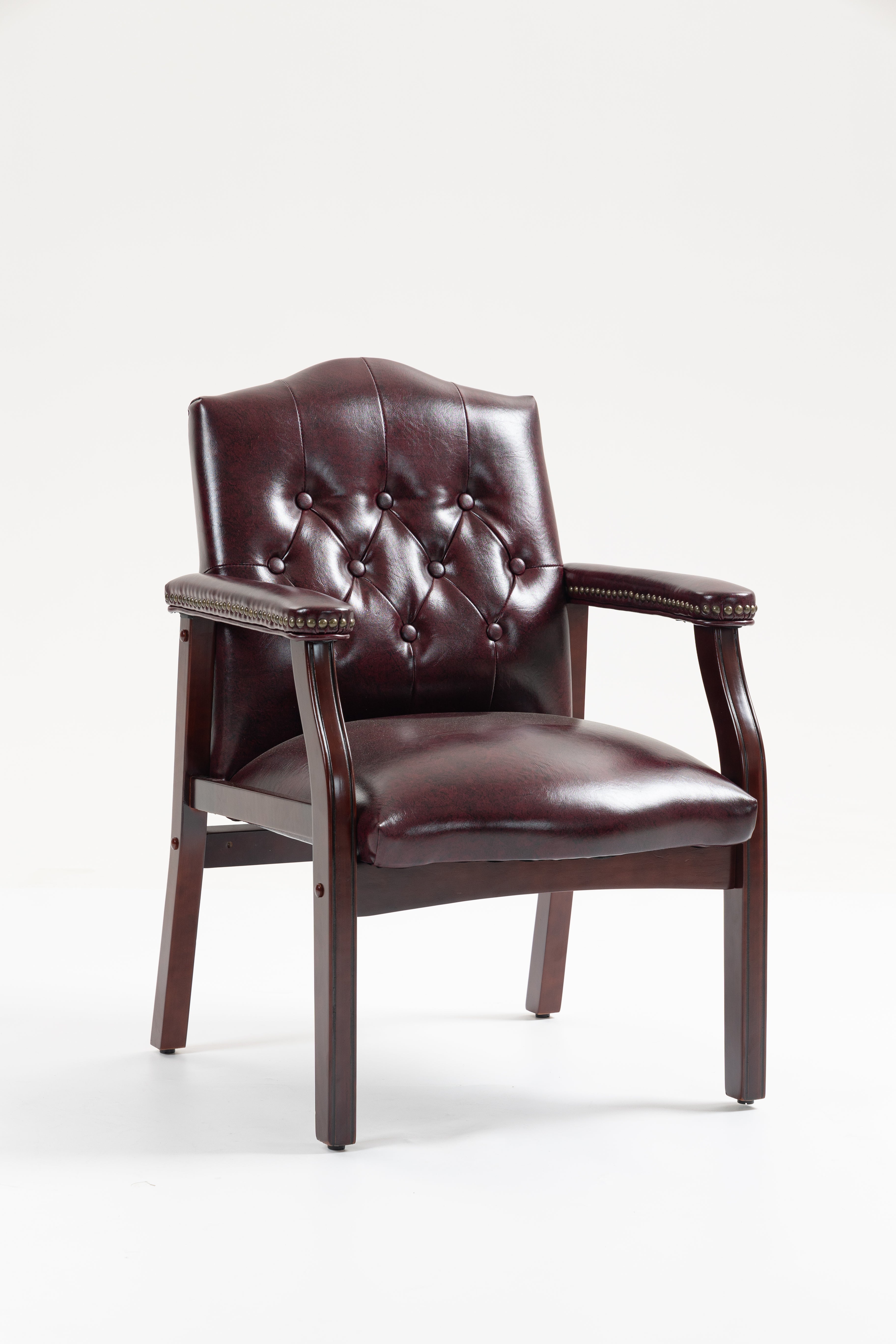 Front view of burgundy leather guest chair with button-tufted seat, padded arms, and mahogany-finish legs